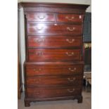 A REPRODUCTION GEORGE III STYLE MAHOGANY CHEST ON CHEST WITH BLIND FRET-WORK DETAIL, THE UPPER