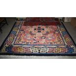 A CHINESE CARPET, THE RECTANGULAR PEACH COLOURED GROUND CENTRED WITH A LARGE FLORAL MEDALLION IN A