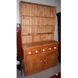 A VINTAGE PINE DRESSER