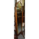 A WALNUT CHEVAL MIRROR