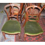 A SET OF SIX VICTORIAN WALNUT SIDE CHAIRS WITH GREEN VELVET UPHOLSTERED SEATS