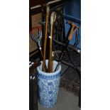 A BLUE AND WHITE CERAMIC STICK / UMBRELLA STAND, DECORATED WITH BIRDS AND MIXED FOLIAGE, TOGETHER