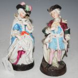 A PAIR OF LATE 19TH / EARLY 20TH CENTURY CONTINENTAL PORCELAIN FIGURE GROUPS, MALE AND ATTENDANT