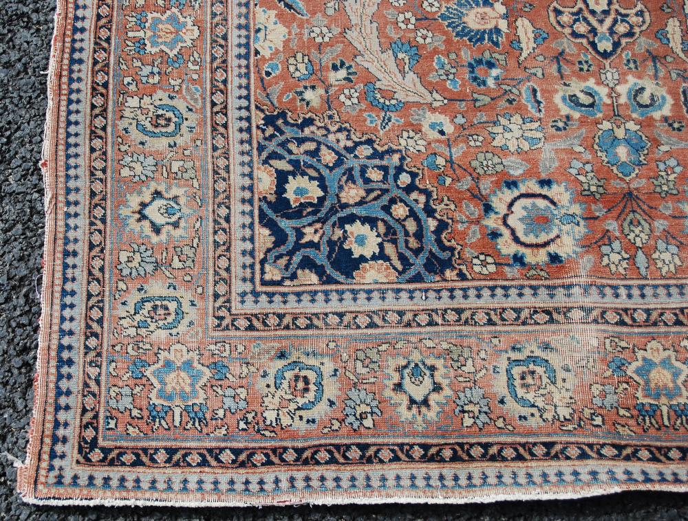 AN ANTIQUE PERSIAN CARPET, THE MADDER FIELD WITH PALMETTES AND SCROLLING FLORAL ARABESQUES WITH A - Image 4 of 9