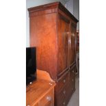 AN ANTIQUE MAHOGANY LINEN PRESS, THE TOP WITH TWO CUPBOARD DOORS OPENING TO THREE SLIDING SHELVES,