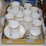 TWO ROYAL WORCESTER PART COFFEE SETS, ONE DECORATED WITH FLOWERS, THE OTHER BUTTERFLIES.