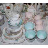 A TUSCAN BLUE LILY PATTERNED TEA SET, TOGETHER WITH A FOLEY TEA SET DECORATED WITH LILIES