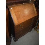 AN EARLY 20TH CENTURY OAK BUREAU