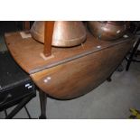 A 19TH CENTURY MAHOGANY DROP-LEAF DINING TABLE ON TAPERED CYLINDRICAL SUPPORTS WITH PAD FEET