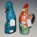 A CHINESE PORCELAIN MODEL OF A COCKEREL TOGETHER WITH A BLUE GLAZED POTTERY MODEL OF A BIRD