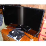 A SAMSUNG 40" CURVE TV AND A SAMSUNG BLU-RAY DVD PLAYER