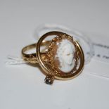 A 9CT GOLD AND CAMEO SET RING, TOGETHER WITH ANOTHER YELLOW METAL SINGLE STONE RING STAMPED '10K'