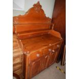 A VINTAGE PINE DRESSER WITH ONE LONG AND ONE SHORT DRAWER OVER TWO CUPBOARD DOORS, THE TOP WITH