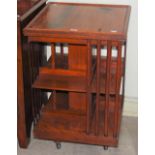 AN OAK SQUARE-SHAPED REVOLVING BOOKCASE