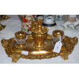 A GILT METAL AND CLEAR GLASS DESK STAND/ INKWELL