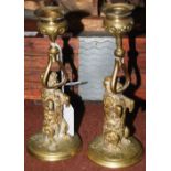 A PAIR OF LATE 19TH/ EARLY 20TH CENTURY GILT METAL DOG-FORM CANDLESTICKS, 17CM HIGH