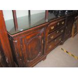 A GEORGE III OAK SIDEBOARD