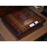 A VICTORIAN MAHOGANY AND PARQUETRY STORAGE BOX IN THE FORM OF A BOOK