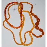 A COLLECTION OF FOUR ASSORTED AMBER TYPE BEAD NECKLACES