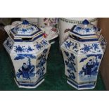 A PAIR OF CHINESE PORCELAIN BLUE AND WHITE HEXAGONAL SHAPED JARS AND COVERS, QING DYNASTY, DECORATED