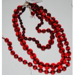 TWO RED AMBER TYPE BEAD NECKLACES AND ANOTHER SIMILAR PART NECKLACE