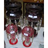 A PAIR OF CLEAR AND PURPLE GLASS TABLE LUSTRES, TOGETHER WITH A PAIR OF SMALLER RUBY AND CLEAR GLASS