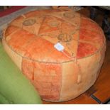 A VINTAGE MOROCCAN STYLE CIRCULAR LEATHER POUFFE