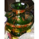 A 20TH CENTURY GREEN GLASS VASE WITH ORANGE AND GILT STYLISED FOLIATE DECORATION