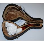 A CARVED MEERSCHAUM PIPE IN FITTED LEATHER CASE
