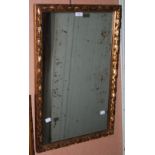 A GILT FRAMED RECTANGULAR WALL MIRROR