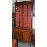 A 19TH CENTURY MAHOGANY BOOKCASE, THE UPPER SECTION WITH TWO GLAZED CUPBOARD DOORS OPENING TO FITTED