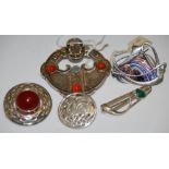 A LARGE SILVER AND AGATE PLAID BROOCH BY OLA GORIE, A SILVER AND GLASS BROOCH BY PAT CHENEY, AND