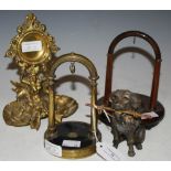 FOUR ASSORTED POCKET WATCH STANDS TO INCLUDE ONE MODELLED AS A DOG SUPPORTING A BAR, A NAUTICAL