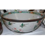 A CHINESE PORCELAIN CRACKLE GLAZED PUNCH BOWL WITH FAMILLE VERT DECORATION OF LONG-TAILED BIRDS