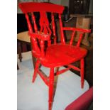 A RED PAINTED PINE KITCHEN ARMCHAIR