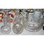 A CUT-GLASS FRUIT/ PUNCH BOWL, TOGETHER WITH FOUR ASSORTED CUT-GLASS DECANTERS AND STOPPERS