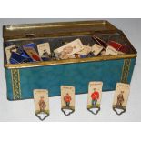 A VINTAGE 'CRAWFORD'S DELIGHTFUL BISCUITS' BISCUIT TIN, CONTAINING A COLLECTION OF VINTAGE