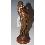 A BRONZE FIGURE OF CUPID SIGNED "G. BALLONI" ON RED MARBLE PLINTH, 17.5CM HIGH