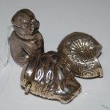 THREE ASSORTED WHITE METAL VESTA HOLDERS, ONE IN THE FORM OF A SEATED DOG, ONE A SHELL, THE OTHER