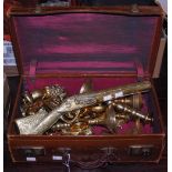 A VINTAGE LEATHER CASE CONTAINING ASSORTED BRASS WARE TO INCLUDE CANDLESTICKS, ORNAMENTAL WARES,