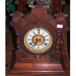 A LATE 19TH CENTURY MANTLE CLOCK OF ARCHITECTURAL FORM WITH ROMAN NUMERAL DIAL AND TWIN TRAIN