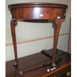 A GEORGE III MAHOGANY DEMILUNE FOLD-OVER OCCASIONAL TABLE