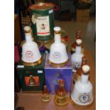 A COLLECTION OF ASSORTED BOXED AND UNBOXED "BELLS" COMMEMORATIVE WHISKY DECANTERS