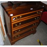 A GEORGE III STYLE WALNUT AND SATINWOOD BANDED CHEST OF FOUR GRADUATED DRAWERS