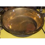 A LARGE BRASS TAPERED CIRCULAR BOWL