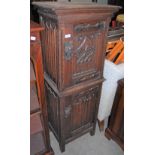 AN ANTIQUE OAK GOTHIC REVIVAL TWO-TIER CUPBOARD, THE UPPER AND LOWER SECTION EACH WITH SINGLE