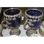 A PAIR OF WHITE METAL MOUNTED COBALT BLUE AND CLEAR GLASS TWIN-HANDLED BOTTLE STANDS