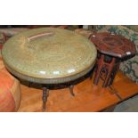 AN INDIAN STYLE BRASS-TOPPED, REVOLVING CIRCULAR TABLE ON FOUR TURNED SUPPORTS, TOGETHER WITH A