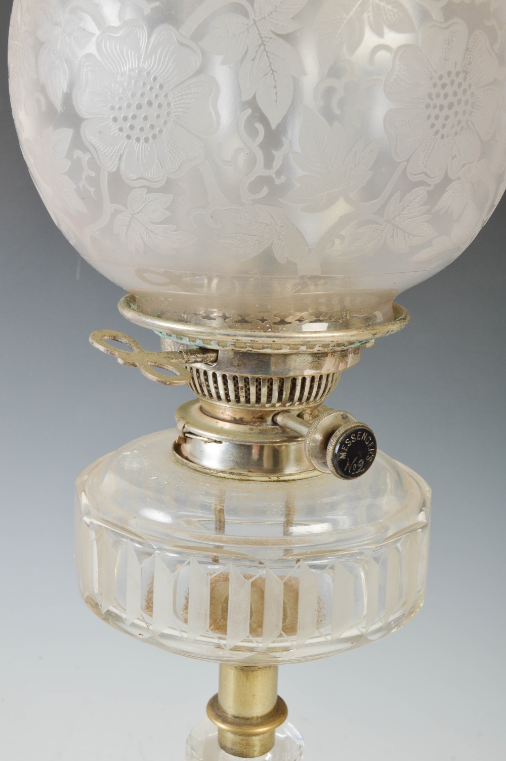 A late 19th/ early 20th century white metal mounted glass oil lamp, with frosted glass shade, the - Image 2 of 3