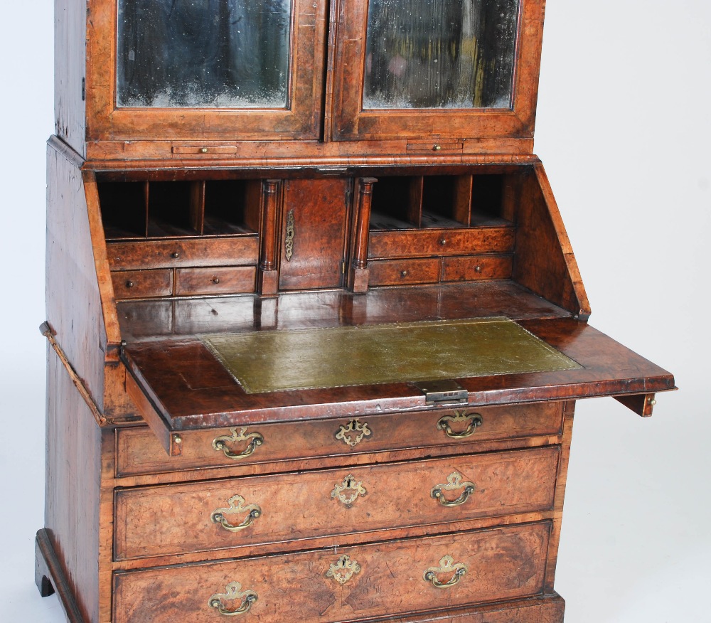 A George III walnut bureau bookcase, the moulded cornice above a pair of mirrored cupboard doors, - Image 6 of 14